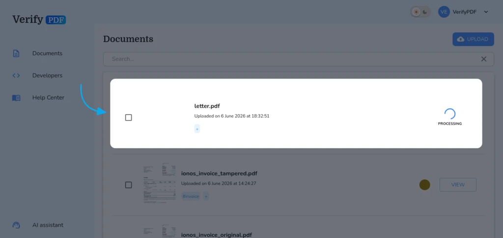 While a document is processing it shows a spinner on the Documents page. Each row updates on its own to Analyzed as soon as the result is ready.